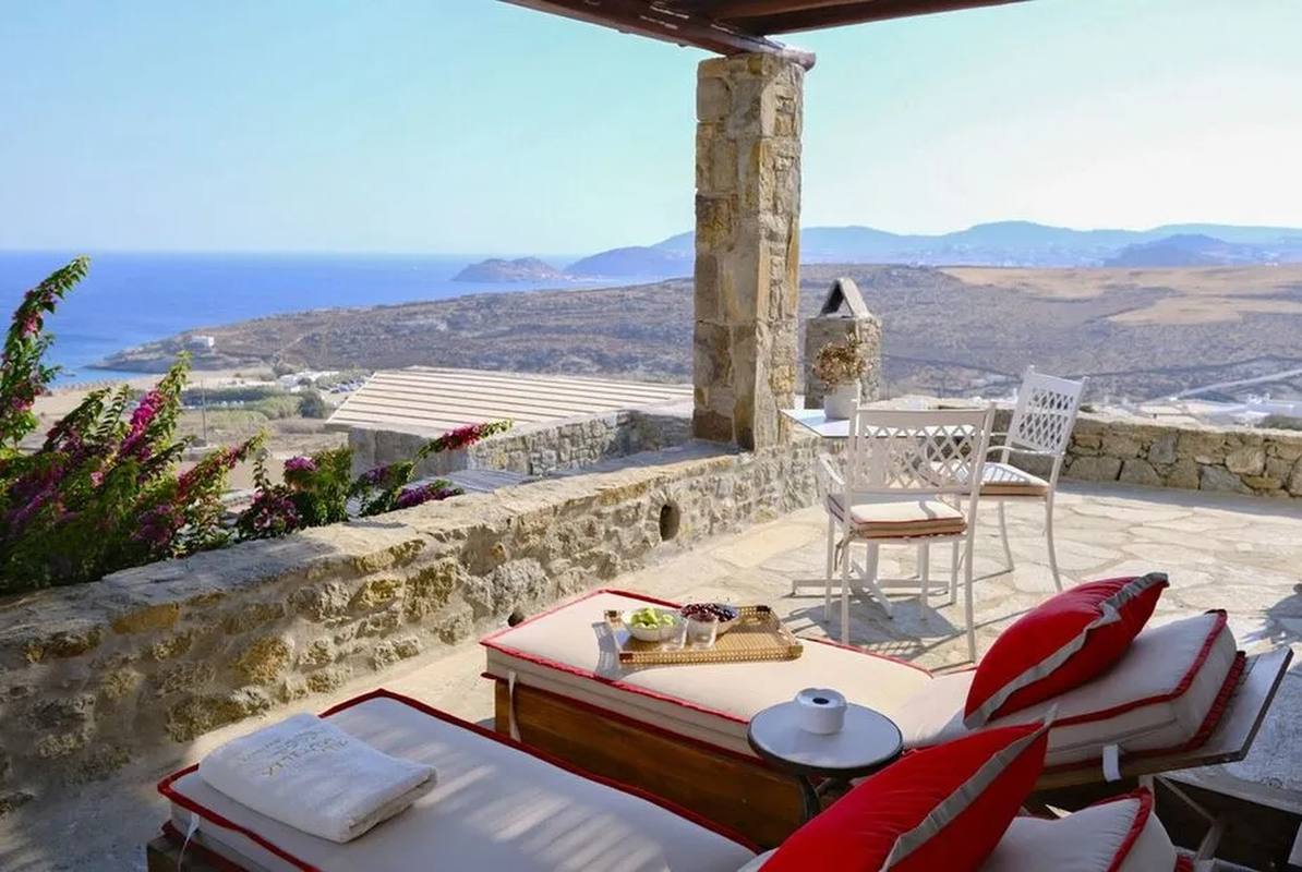 Villa Megalo — terrace loungers with Aegean