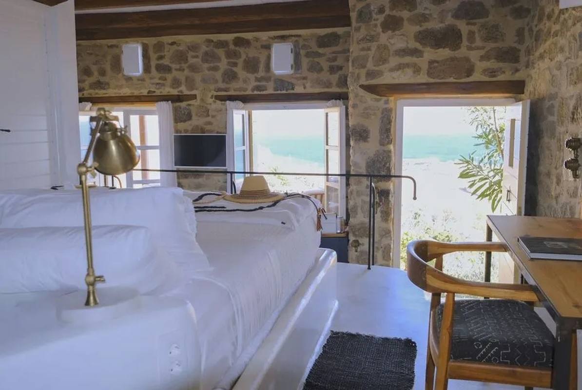 Villa Megalo — bedroom with stone walls